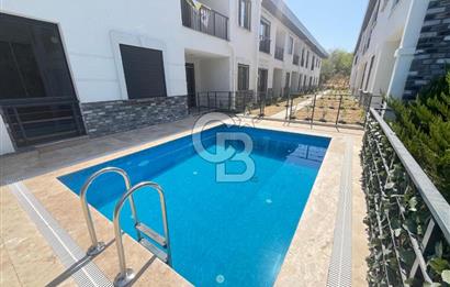 GÜRE ÇAMLIBELDE BAHÇE KULLANIMLI HAVUZLU SATILIK 1+1 DAİRE