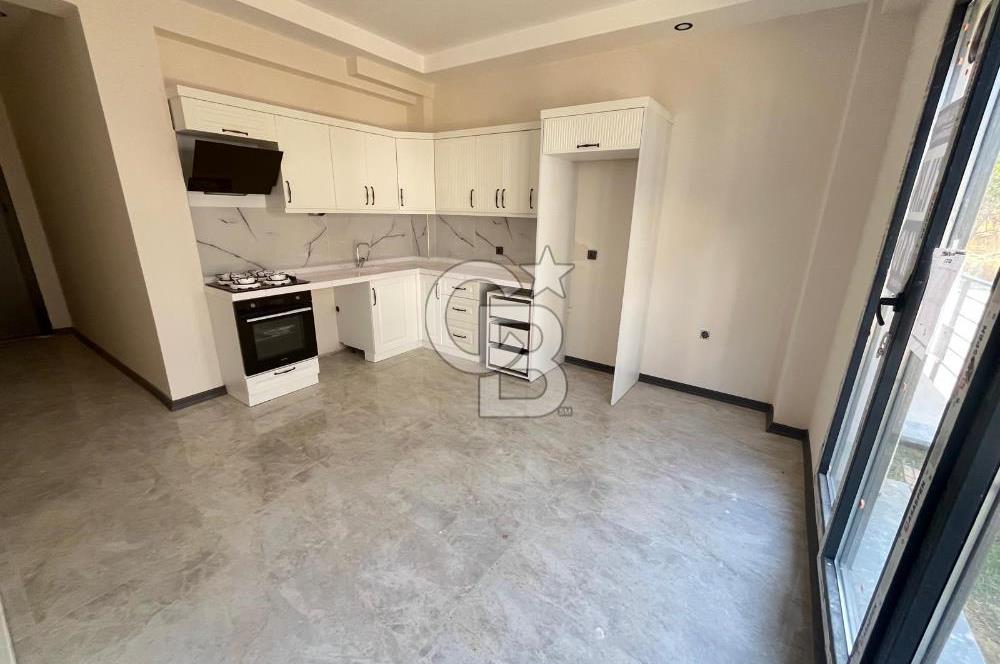 GÜRE ÇAMLIBELDE BAHÇE KULLANIMLI HAVUZLU SATILIK 1+1 DAİRE