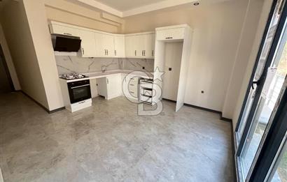 GÜRE ÇAMLIBELDE BAHÇE KULLANIMLI HAVUZLU SATILIK 1+1 DAİRE