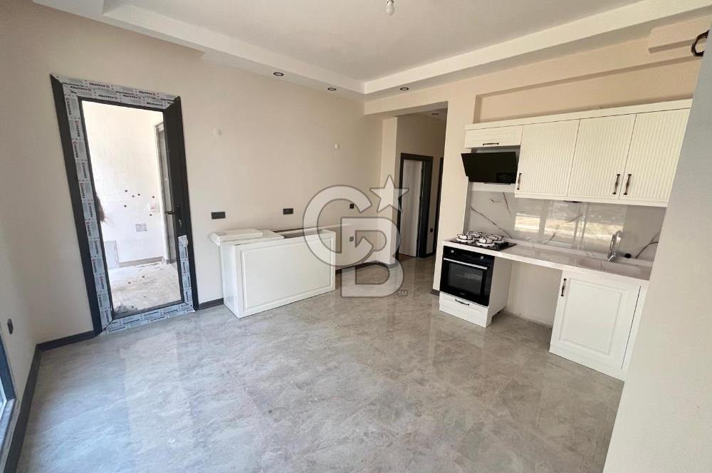GÜRE ÇAMLIBELDE BAHÇE KULLANIMLI HAVUZLU SATILIK 1+1 DAİRE