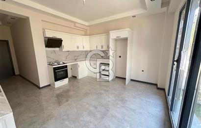 GÜRE ÇAMLIBELDE BAHÇE KULLANIMLI HAVUZLU SATILIK 1+1 DAİRE