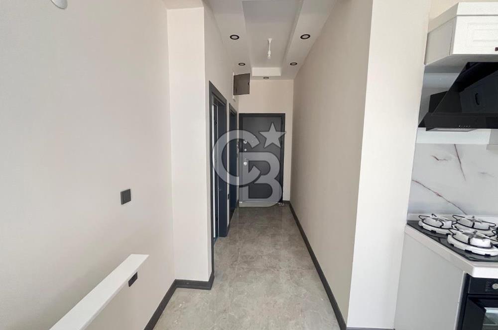 GÜRE ÇAMLIBELDE BAHÇE KULLANIMLI HAVUZLU SATILIK 1+1 DAİRE