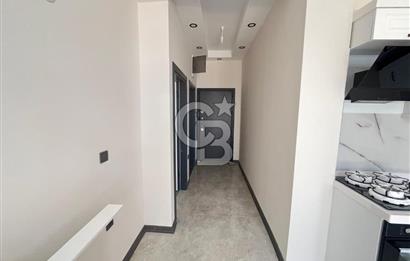 GÜRE ÇAMLIBELDE BAHÇE KULLANIMLI HAVUZLU SATILIK 1+1 DAİRE
