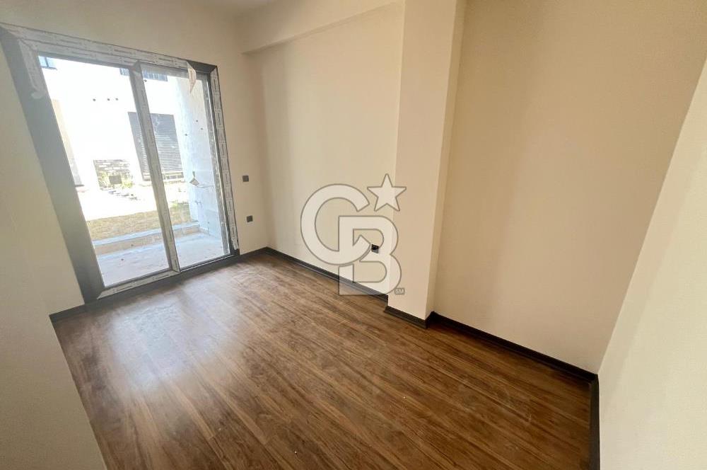 GÜRE ÇAMLIBELDE BAHÇE KULLANIMLI HAVUZLU SATILIK 1+1 DAİRE