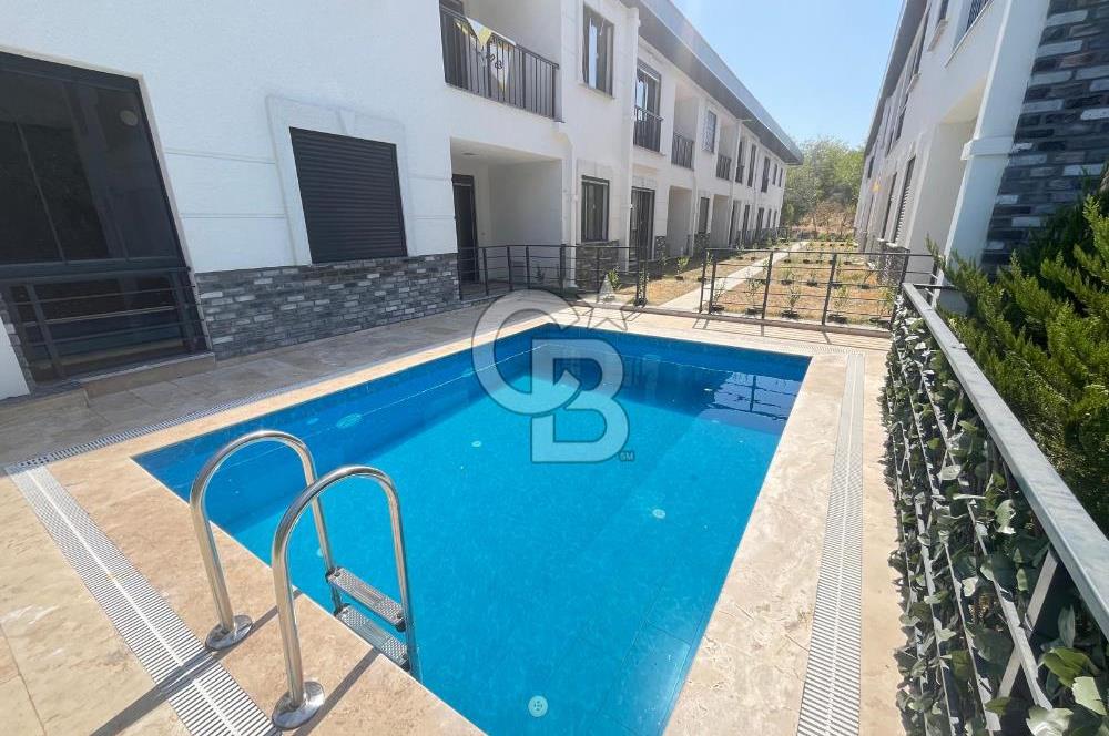 GÜRE ÇAMLIBELDE BAHÇE KULLANIMLI HAVUZLU SATILIK 1+1 DAİRE