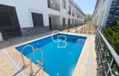 GÜRE ÇAMLIBELDE BAHÇE KULLANIMLI HAVUZLU SATILIK 1+1 DAİRE