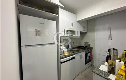 KUŞADASI MERKEZ'DE SATILIK 1+1 bAHÇE KATI