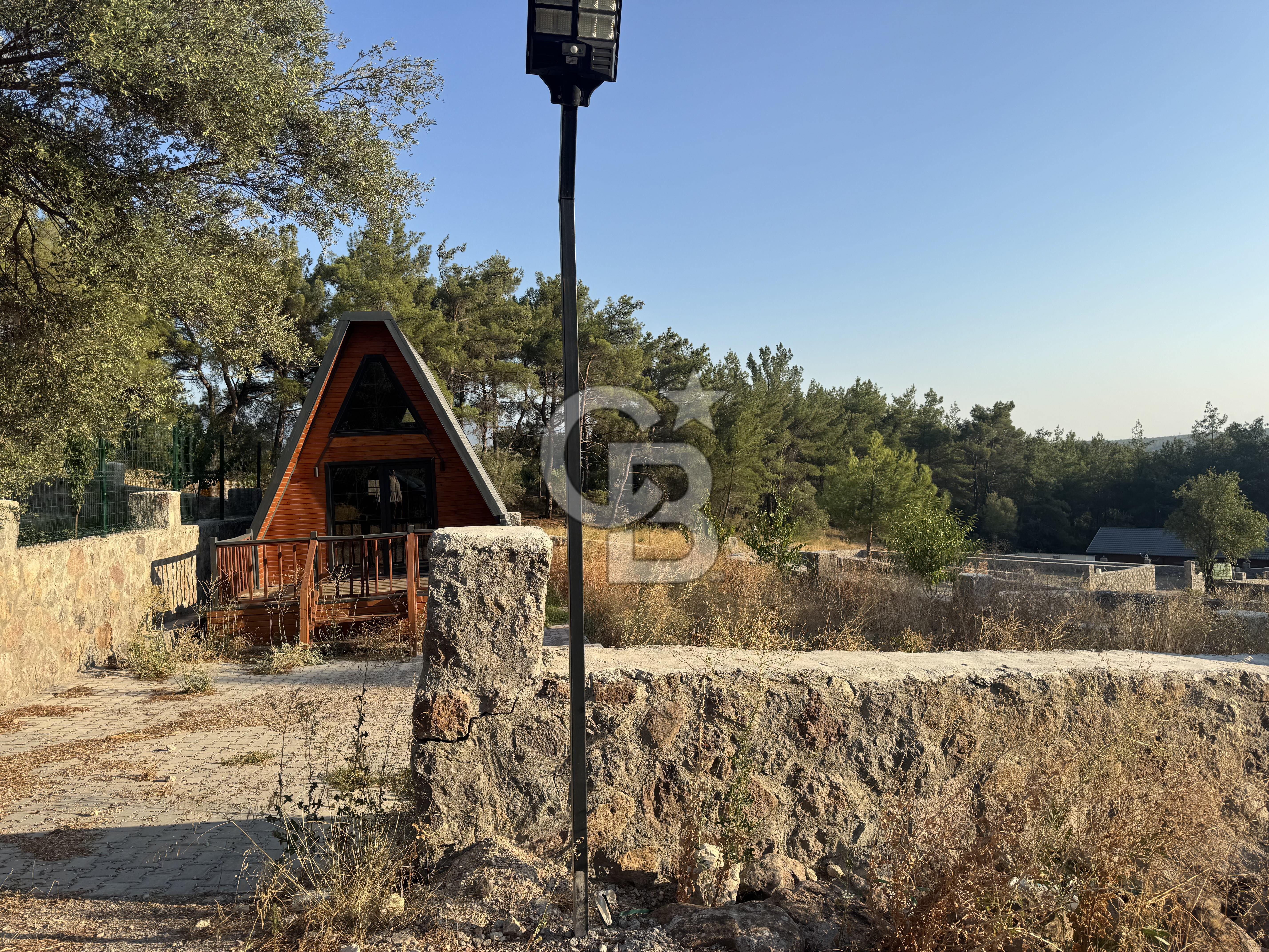 Bornova Yakaköyde 300 m² koop.hisseli arsa +1+1 bungalov ev