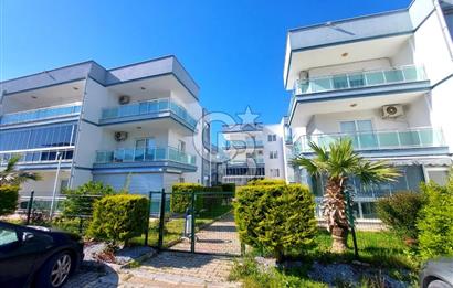 KUŞADASI DAVUTLAR SİTE İÇİNDE SAHİLE YAKIN YENİ 1+1 SATILIK DAİRE 