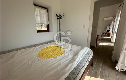 BOZCAADA CUMHURİYET MAHALLESİ’NDE DOĞAL TAŞ EV ve 1.768 m² ARSA