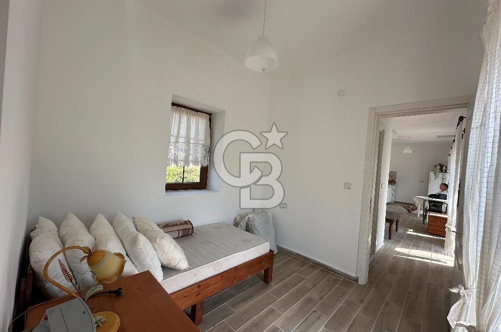 BOZCAADA CUMHURİYET MAHALLESİ’NDE DOĞAL TAŞ EV ve 1.768 m² ARSA