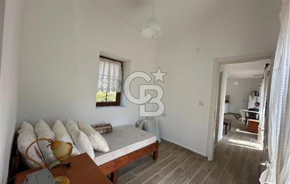 BOZCAADA CUMHURİYET MAHALLESİ’NDE DOĞAL TAŞ EV ve 1.768 m² ARSA