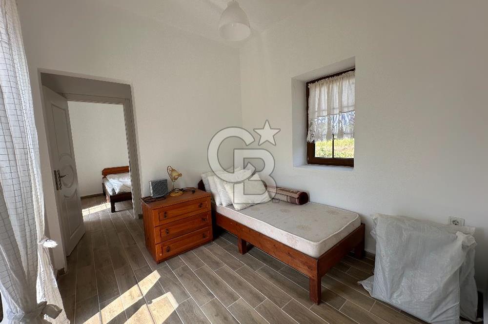 BOZCAADA CUMHURİYET MAHALLESİ’NDE DOĞAL TAŞ EV ve 1.768 m² ARSA