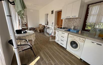 BOZCAADA CUMHURİYET MAHALLESİ’NDE DOĞAL TAŞ EV ve 1.768 m² ARSA