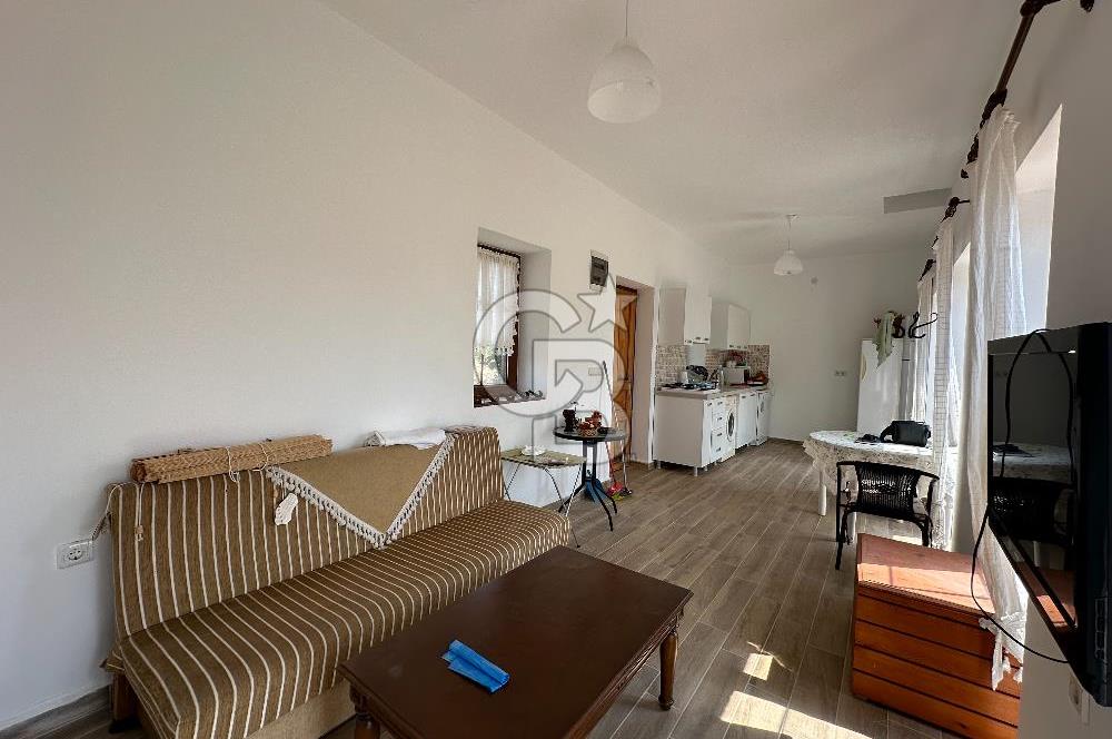 BOZCAADA CUMHURİYET MAHALLESİ’NDE DOĞAL TAŞ EV ve 1.768 m² ARSA