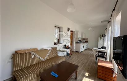 BOZCAADA CUMHURİYET MAHALLESİ’NDE DOĞAL TAŞ EV ve 1.768 m² ARSA