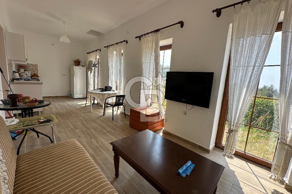BOZCAADA CUMHURİYET MAHALLESİ’NDE DOĞAL TAŞ EV ve 1.768 m² ARSA