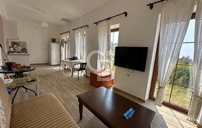 BOZCAADA CUMHURİYET MAHALLESİ’NDE DOĞAL TAŞ EV ve 1.768 m² ARSA