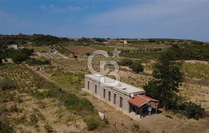 BOZCAADA CUMHURİYET MAHALLESİ’NDE DOĞAL TAŞ EV ve 1.768 m² ARSA