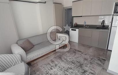KARŞIYAKA ÇARŞI İÇİNDE SIFIR BİNA SIFIR EŞYALI 1+1 DAİRE