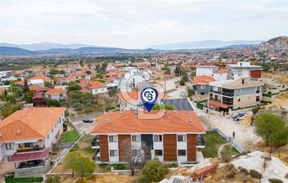 Foça Yenibağarası Mah. Satılık 2+1 Bahçe Katı Daire