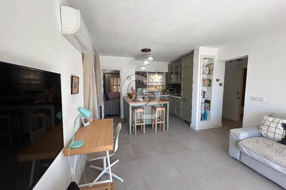 Palamutbükü Mertur Sitesi’nde Denize Yakın Yenilenmiş 2+1 Bahçe Katı Daire