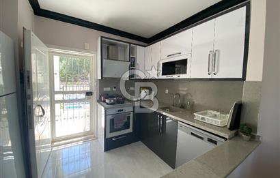 Akbükün Kalbinde,Üç Manzarayı Bir Arada Sunan 2+1 Satılık Daire