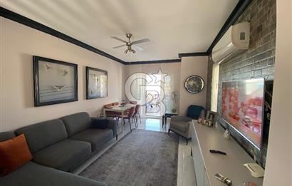 Akbükün Kalbinde,Üç Manzarayı Bir Arada Sunan 2+1 Satılık Daire