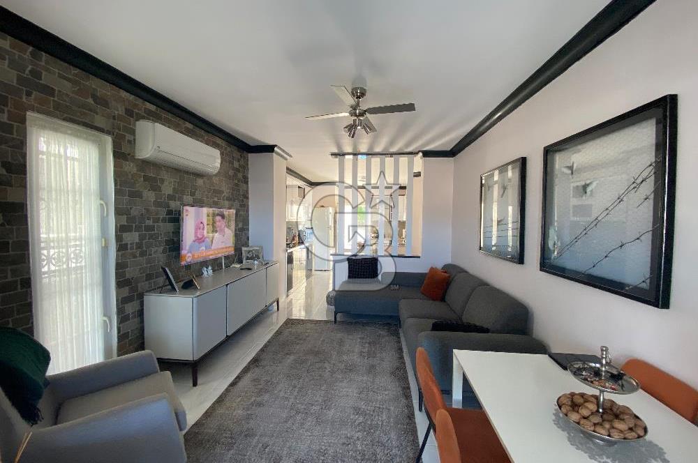 Akbükün Kalbinde,Üç Manzarayı Bir Arada Sunan 2+1 Satılık Daire