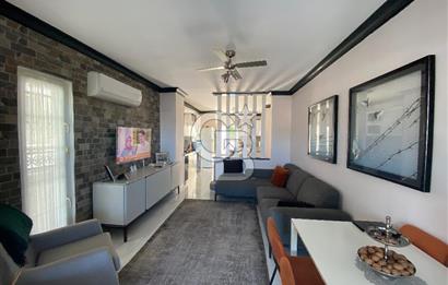 Akbükün Kalbinde,Üç Manzarayı Bir Arada Sunan 2+1 Satılık Daire