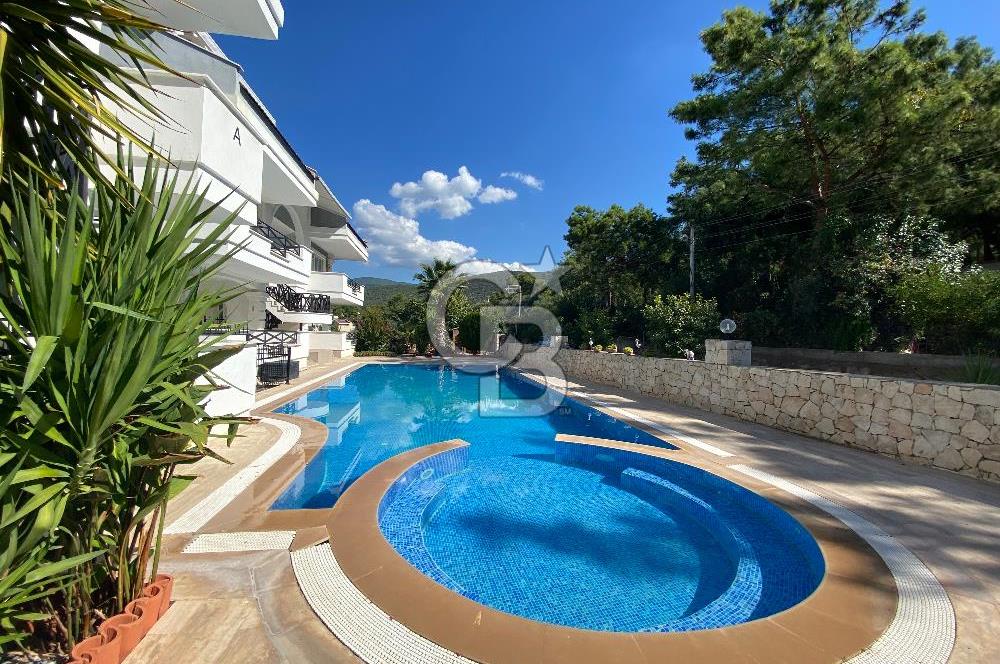 Akbükün Kalbinde,Üç Manzarayı Bir Arada Sunan 2+1 Satılık Daire