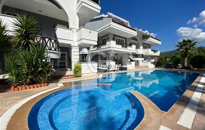 Akbükün Kalbinde,Üç Manzarayı Bir Arada Sunan 2+1 Satılık Daire