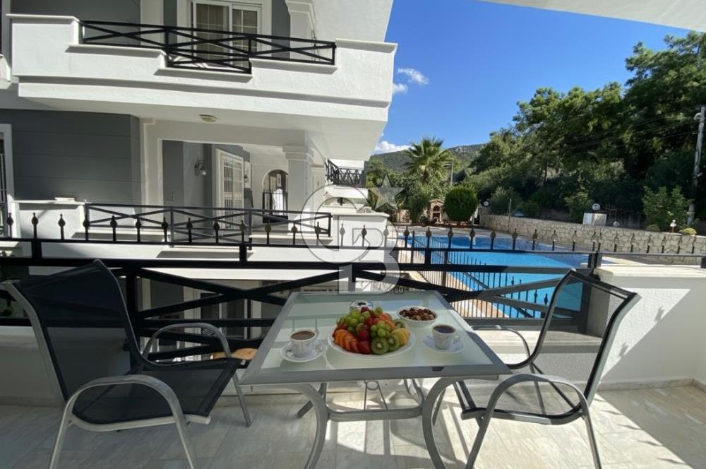 Akbükün Kalbinde,Üç Manzarayı Bir Arada Sunan 2+1 Satılık Daire