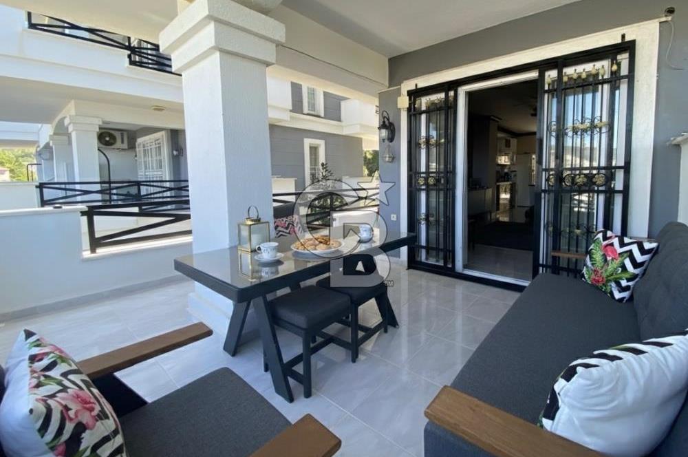 Akbükün Kalbinde,Üç Manzarayı Bir Arada Sunan 2+1 Satılık Daire