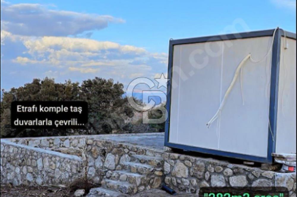 AYVACIK İLÇESİ'NE 3KM. TAŞ DUVARLI,İÇİNDE YAPI OLAN"282M2 ARSA"