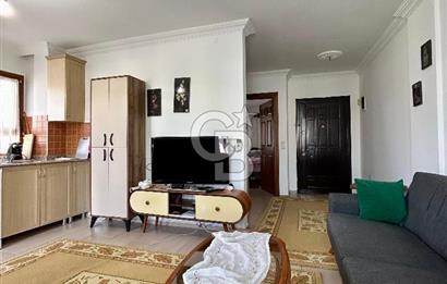 Datça — TAM MERKEZDE, BAHÇELİ & KAPALI BALKONLU 1+1 SATILIK DAİRE