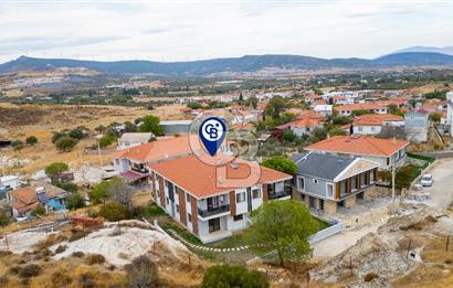 Foça Yenibağarası Mah. Satılık 2+1 Bahçe Katı Daire