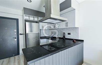 KUŞADASI KUŞTUR MAHALLESİNDE DENİZE YÜRÜME MESAFESİNDE 1+1 RESİDENCE 