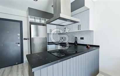 KUŞADASI KUŞTUR MAHALLESİNDE DENİZE YÜRÜME MESAFESİNDE 1+1 RESİDENCE 