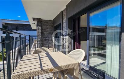 KUŞADASI KUŞTUR MAHALLESİNDE DENİZE YÜRÜME MESAFESİNDE 1+1 RESİDENCE 