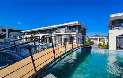 KUŞADASI KUŞTUR MAHALLESİNDE DENİZE YÜRÜME MESAFESİNDE 1+1 RESİDENCE 