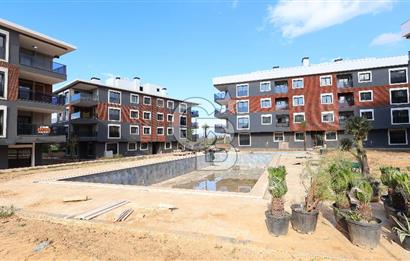 Torbalı Kipa'ya komşu havuzlu güvenlikli sitede sıfır 2+1..