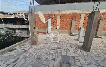 Bayraklı Tepekule Mahallesinde 100 m2 arsa için de 2 kat 2 daire.