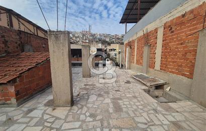 Bayraklı Tepekule Mahallesinde 100 m2 arsa için de 2 kat 2 daire.