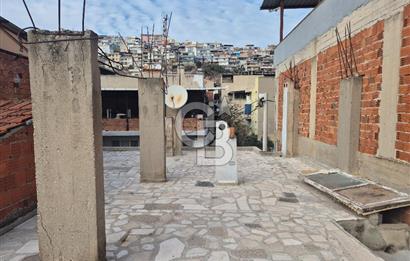 Bayraklı Tepekule Mahallesinde 100 m2 arsa için de 2 kat 2 daire.