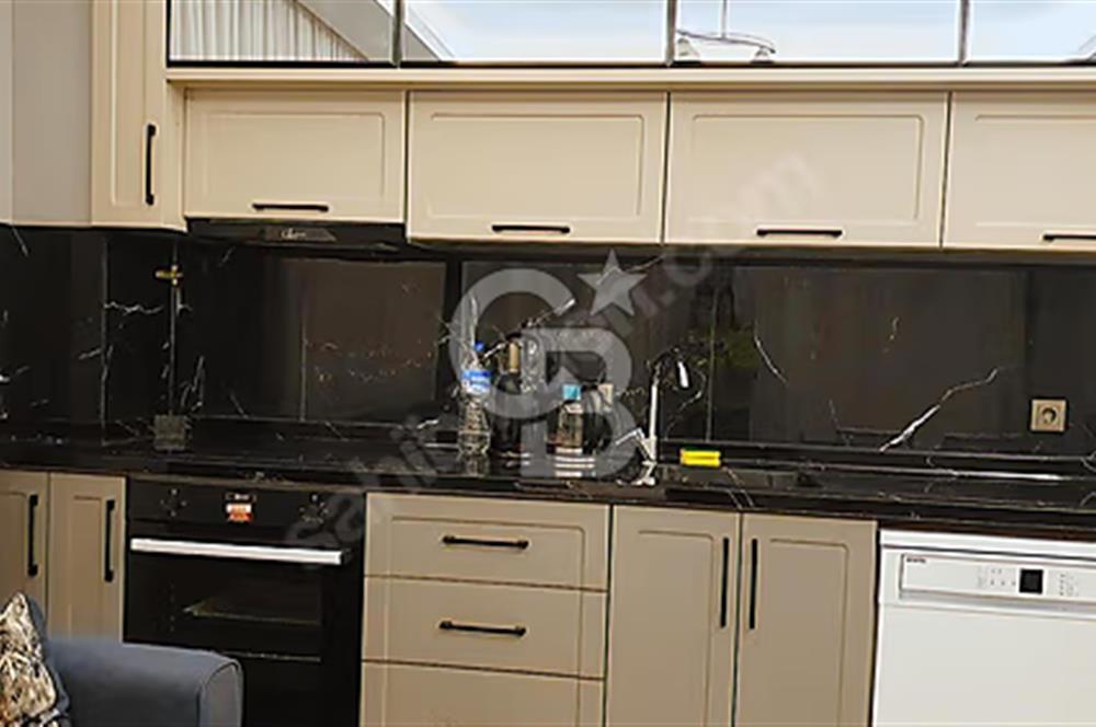 İncek mahallesinde full mobilyalı merkezi konumda 1+1 daire