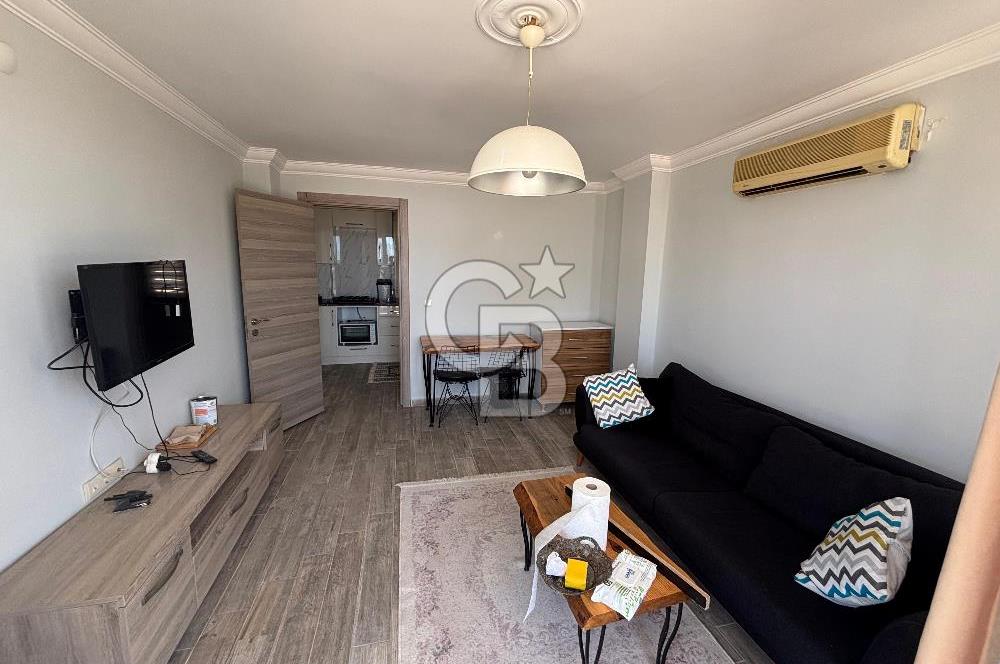 ÇANDARLI'DA DENİZ MANZARALI VE BAHÇELİ GENİŞ 1+1 DAİRE