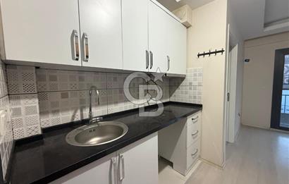 BAYRAKLI DA İZBANA YAKIN YENİ BİNADA ARA KAT SATILIK 1+1 DAİRE 