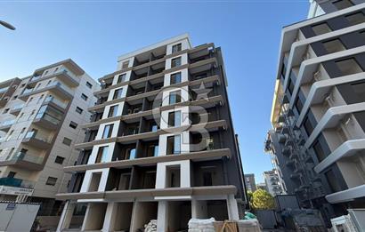 Plaza Bölgesi Bayraklı Satılık Sıfır 1+1 Daire