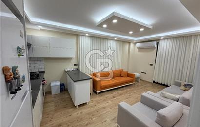 Didim Cumhuriyet'te merkezi konumda 2+1 Bahçe katı Satılık Daire